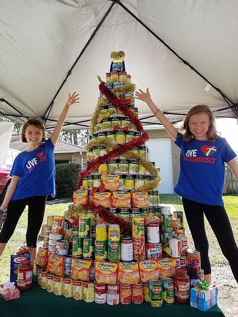 Family builds six-foot Christmas tree out of canned food, donates it ...