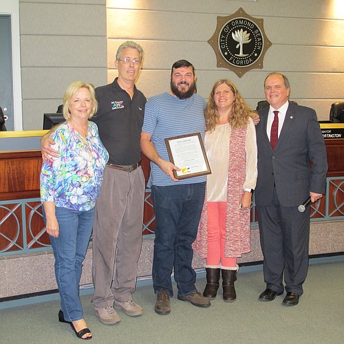 Dyson Billings is shown with the proclamation he received from the city. Shown are Diane and Randy Ingersoll; Billings; Dawn Billings; and Mayor Bill Partington