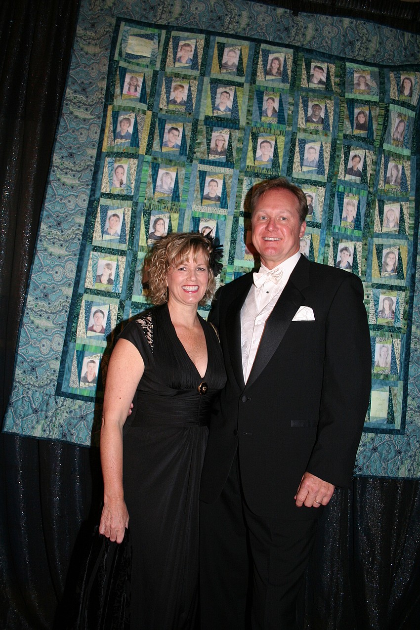 Kate and John Haskins and this year's senior class quilt