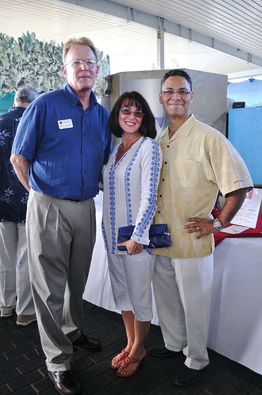 American Red Cross Executive Director Kevin Lindberg with Donna and Rick Espino