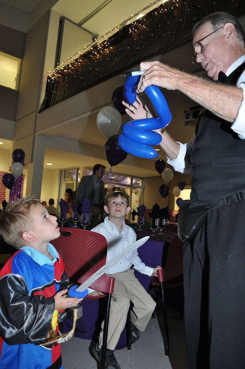 Hayden Stroud watches his balloon being made