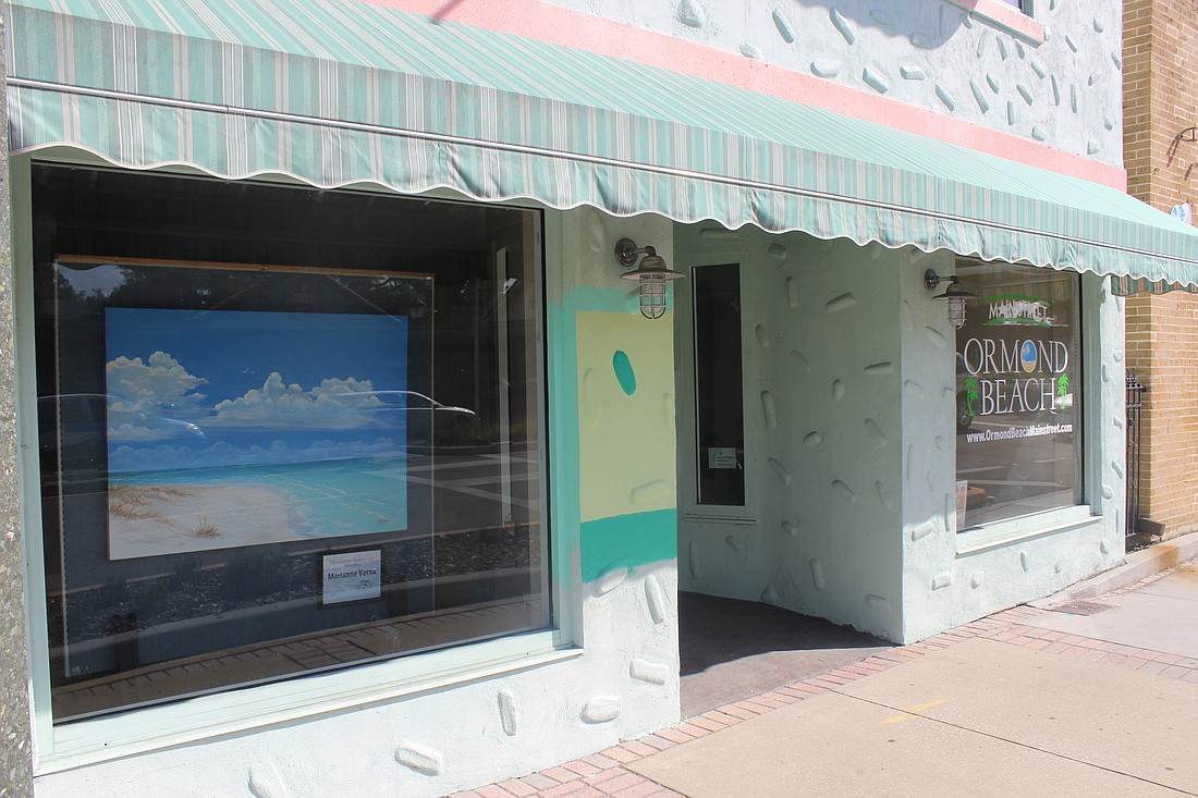 Marianne Verna's artwork is currently hanging in Ormond Mainstreet's building, and she hopes to bring more of that to more businesses along West Granada Boulevard (Photo by Emily Blackwood).