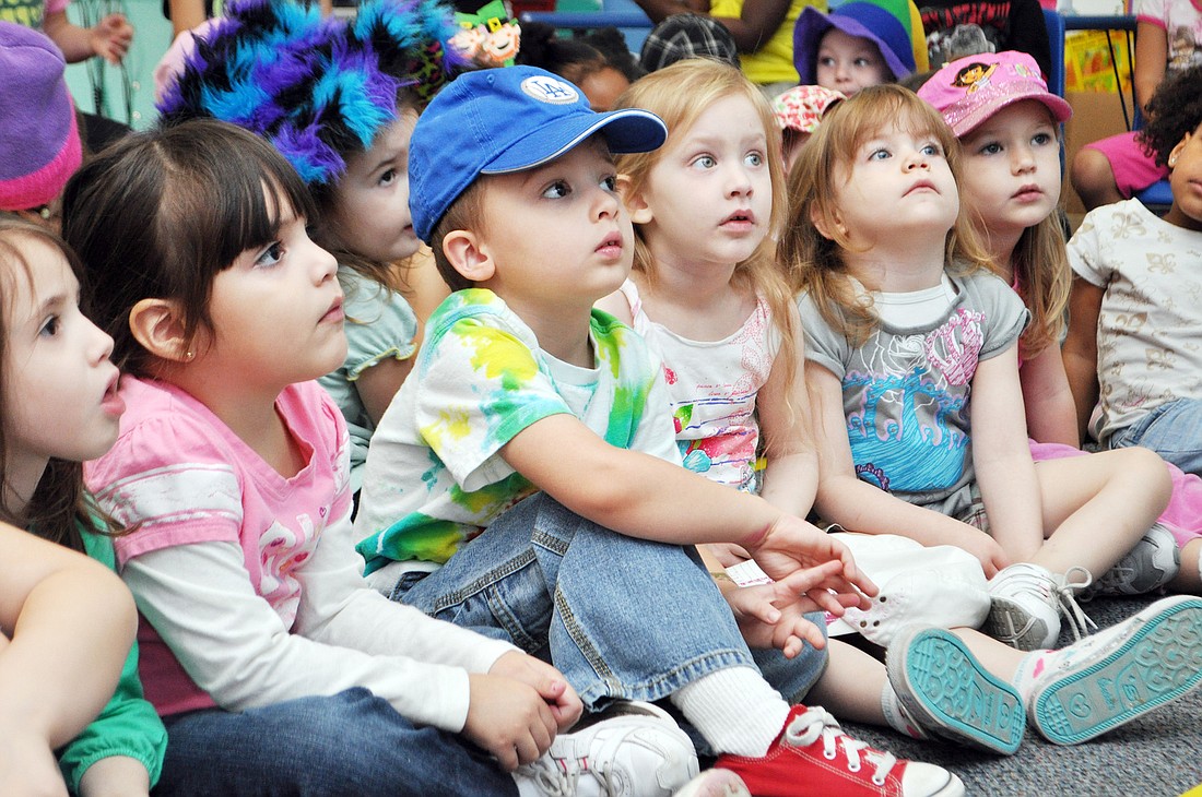 Preschool students Isabella Watson, Byron Struble, Ava Hughes, Maddie Wilson and Jaysa Hopkins listen to the Cat in the Hat read. PHOTOS BY SHANNA FORTIER