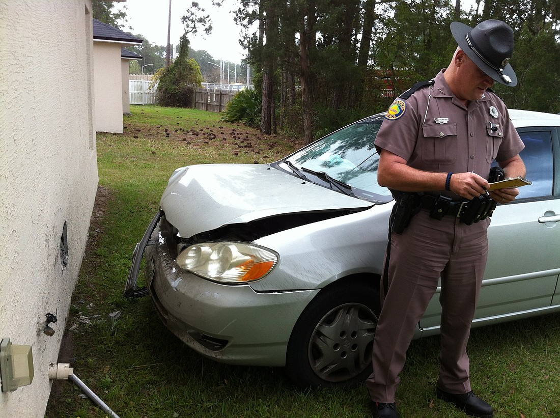 Florida Highway Patrol Trooper Leonard Yuknavage at the scene of the crash.