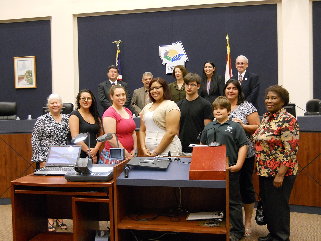 Back row, from left: Nate McLaughlin, George Hanns, Barbara Revels, Milissa Holland, Allan Peterson; front: Terry Williams, Eryn Bock, Ashley Bock, KayKay Galvin and Justyn Perry, Tyler Perry, Cheryl Perry and Verna Goodridge