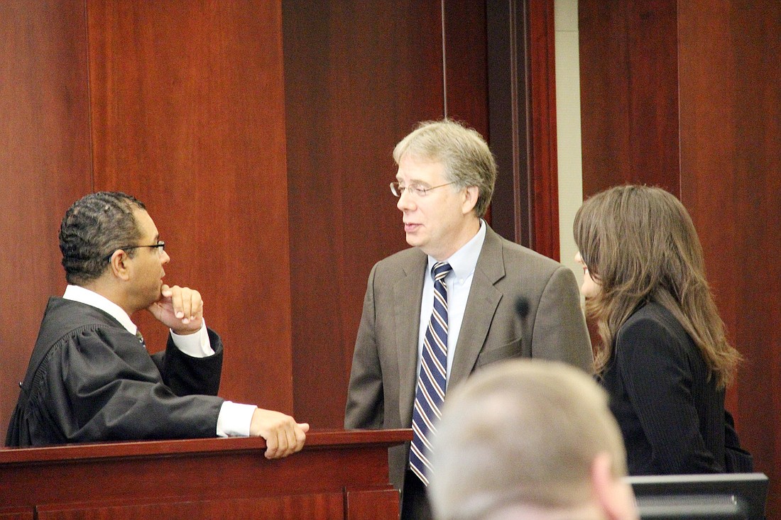 Judge Raul Zambrano called prosecutors Russ Bausch and Laura Moody to the bench March 20.