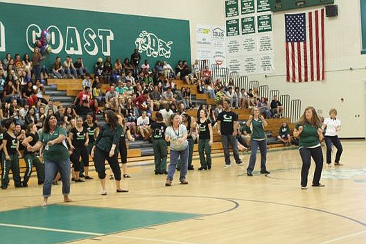 Teachers Cheryl Perry, Kathy Picano, Johanna Davis, Jan Kinnaly and Debbie Ellis, with Stacia Collier in the front row, perform a hip hop dance routine.