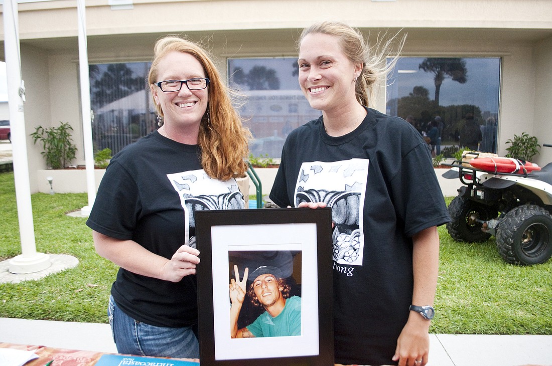 Jaffy Lee and Kelly Brasol sell shirts in memory of Mike Ã¢â‚¬Å“BowlerÃ¢â‚¬Â Cristello.