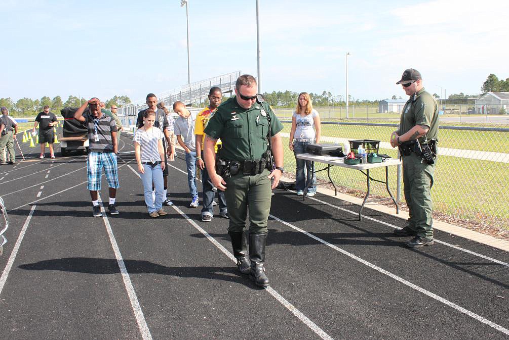 Deputy Scott Vetter demonstrates field sobriety tests administered to suspected drunk drivers.