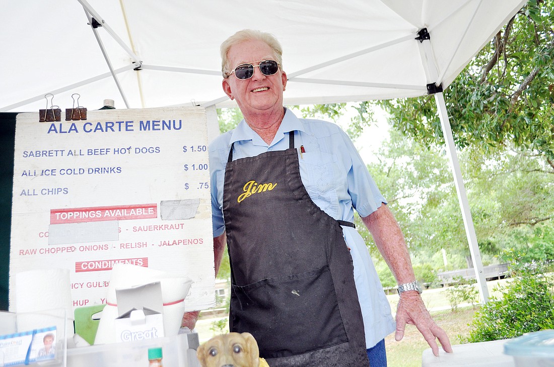 Jim Ã¢â‚¬Å“The hot dog manÃ¢â‚¬Â Bradley, whose stand is at 4888 W. Palm Coast Parkway, presents checks to local charities quarterly.