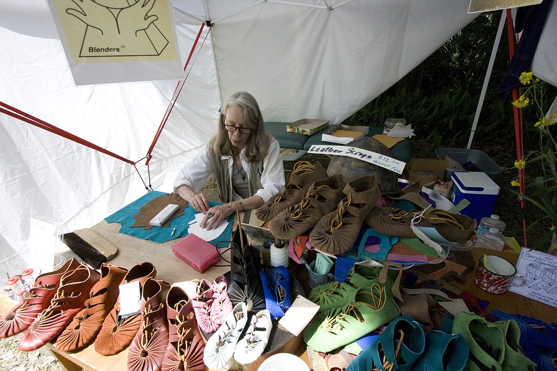 Tina Yoxtheimer, owner of BlendersÃ¢â‚¬â„¢ Shoes, creates a pair of hand-crafted Egyptian shoes at the 2010 celebration. FILE PHOTO BY SHANNA FORTIER