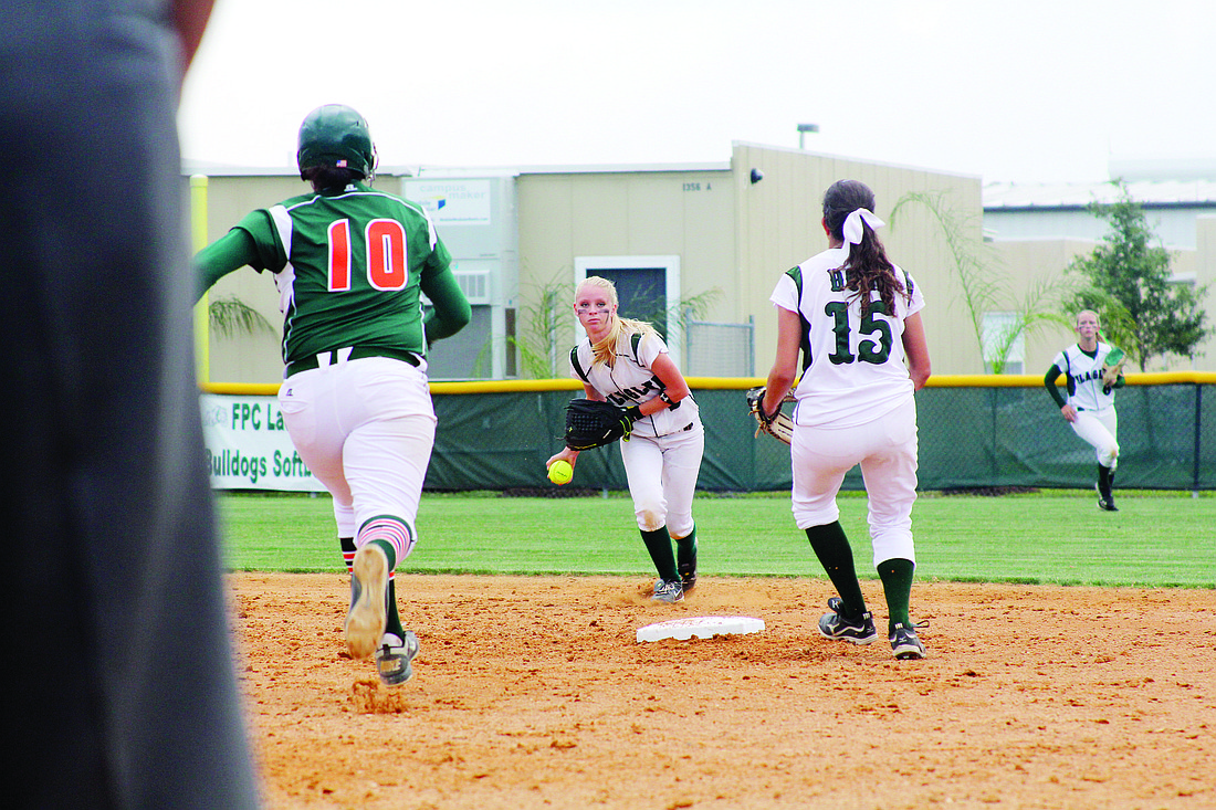 Shortstop Destiny Kelly flips to Maria Matty for the force out at second base. PHOTOS BY BRIAN MCMILLAN