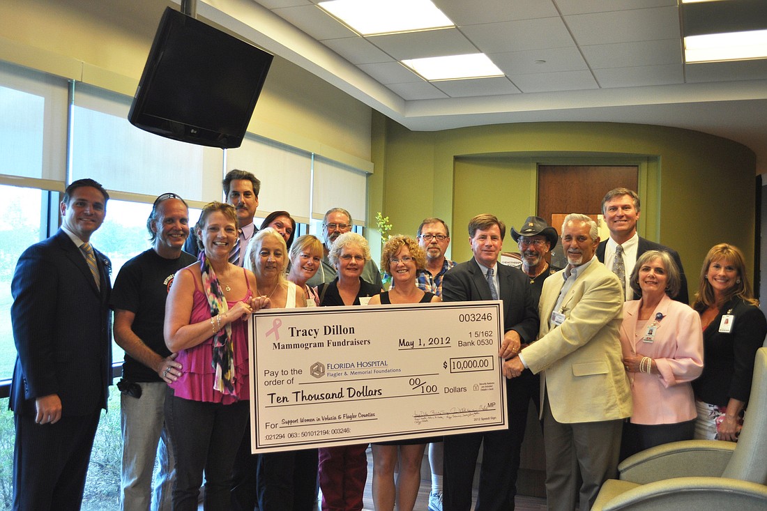Members of the Tracy Dillon Mammogram Fundraisers present a $10,000 check to the Florida Hospital Flagler and Florida Hospital Memorial Foundations.