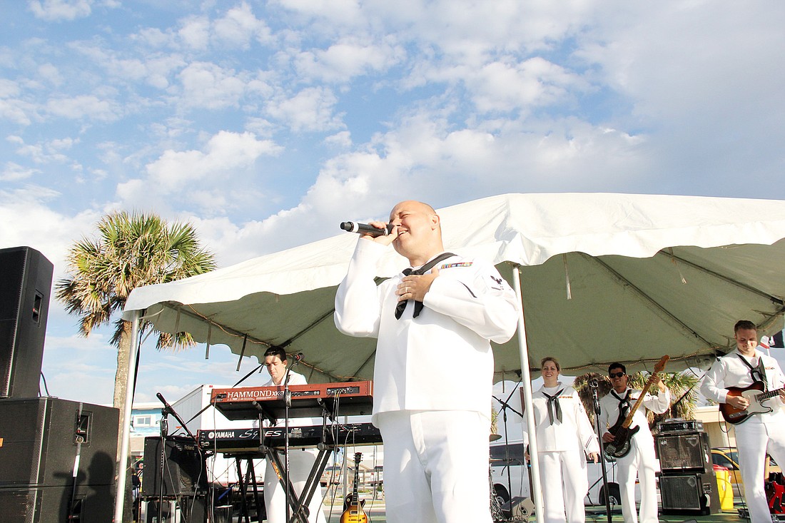 Musician third class Sean Mayer, of Palm Coast, sings with the U.S. Navy Band Pride, at First Friday in Flagler Beach.