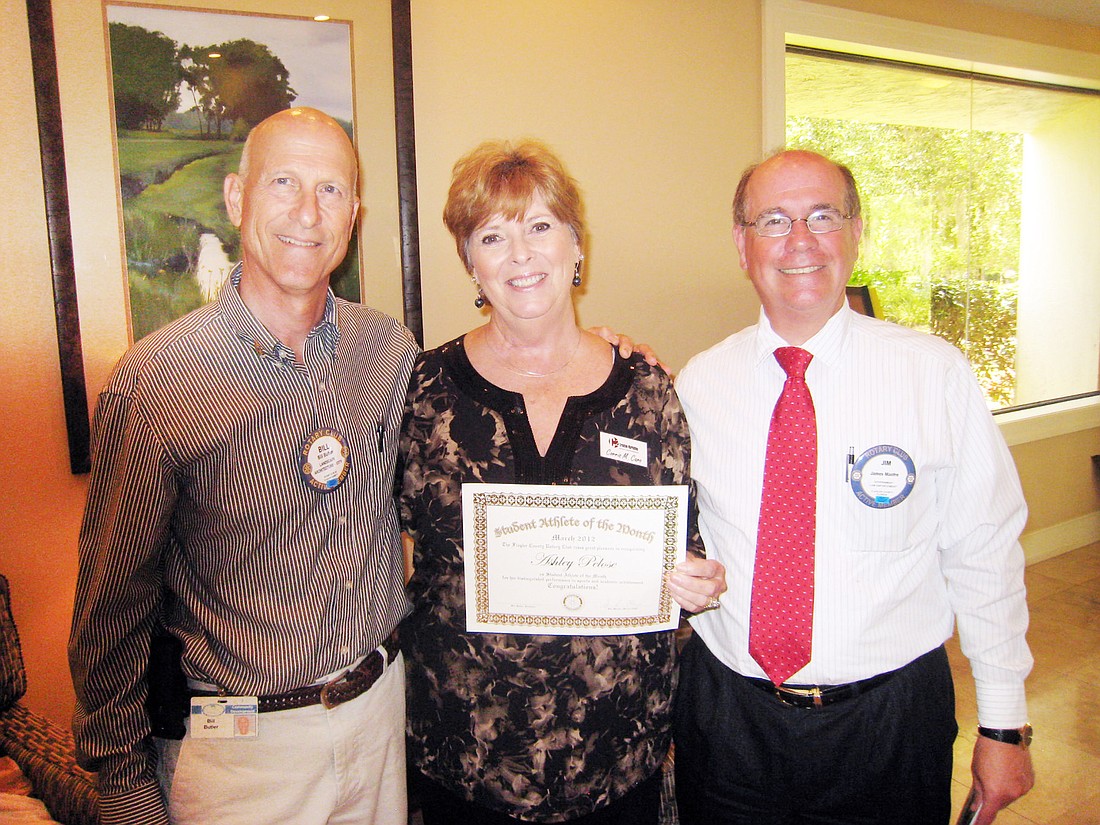 Rotary Club of Flagler County President Bill Butler, Corris Caro, of C2 Creative Marketing, and Student Athlete Program Chairman Jim Manfre. COURTESY PHOTO