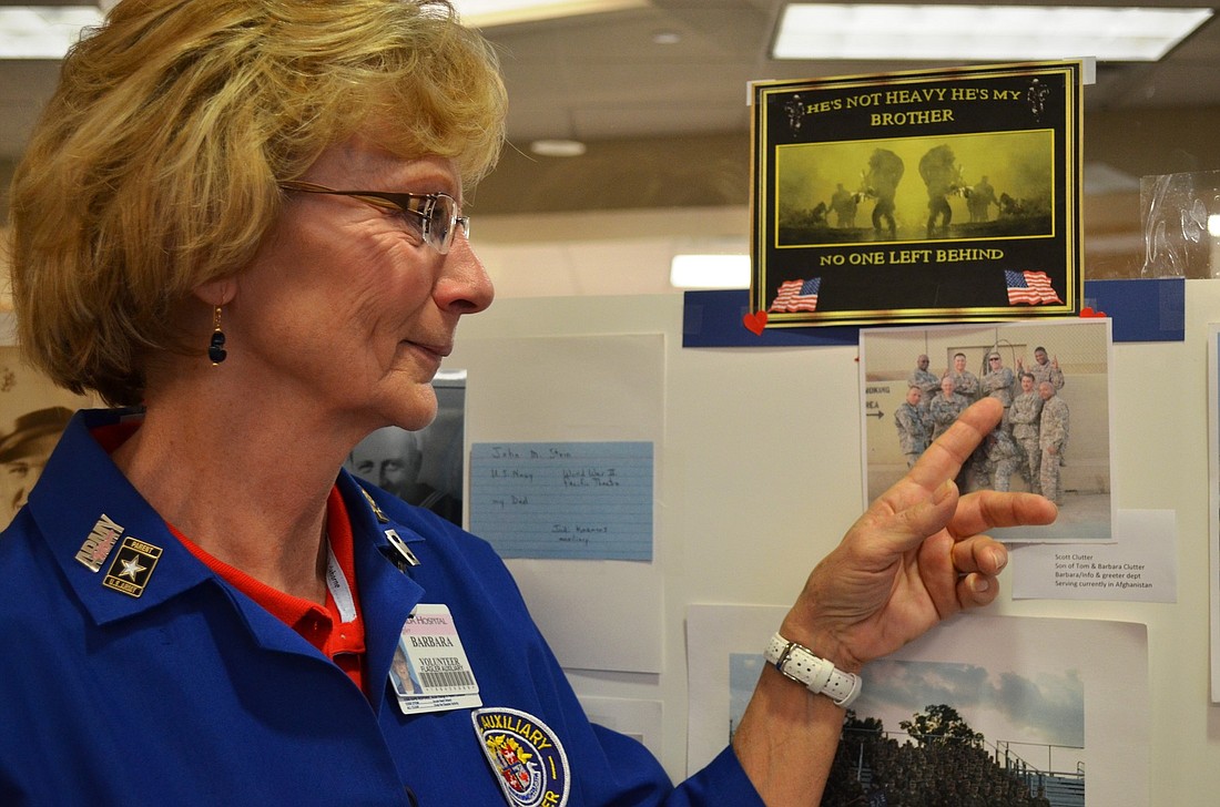 Barbara Clutter, Florida Hospital Flagler volunteer points to a photo of her son, Scott, who is deployed in Afghanistan.