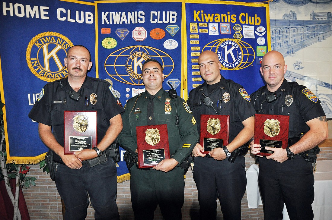 Officer Robert Burn, Sgt. Philip Reynolds, and officers Agustin Rodriguez and George Hristakopoulos.