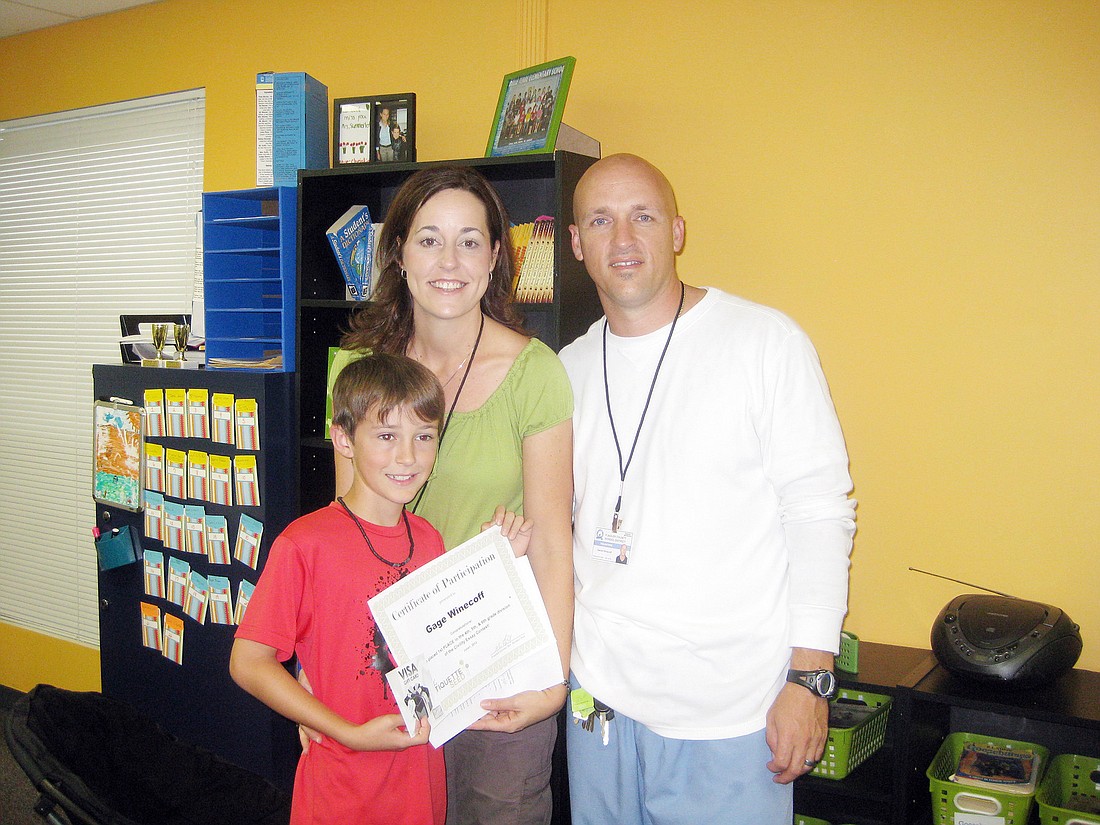 Gage Winecoff and his parents, Jenifer and ScotT. COURTESY PHOTO
