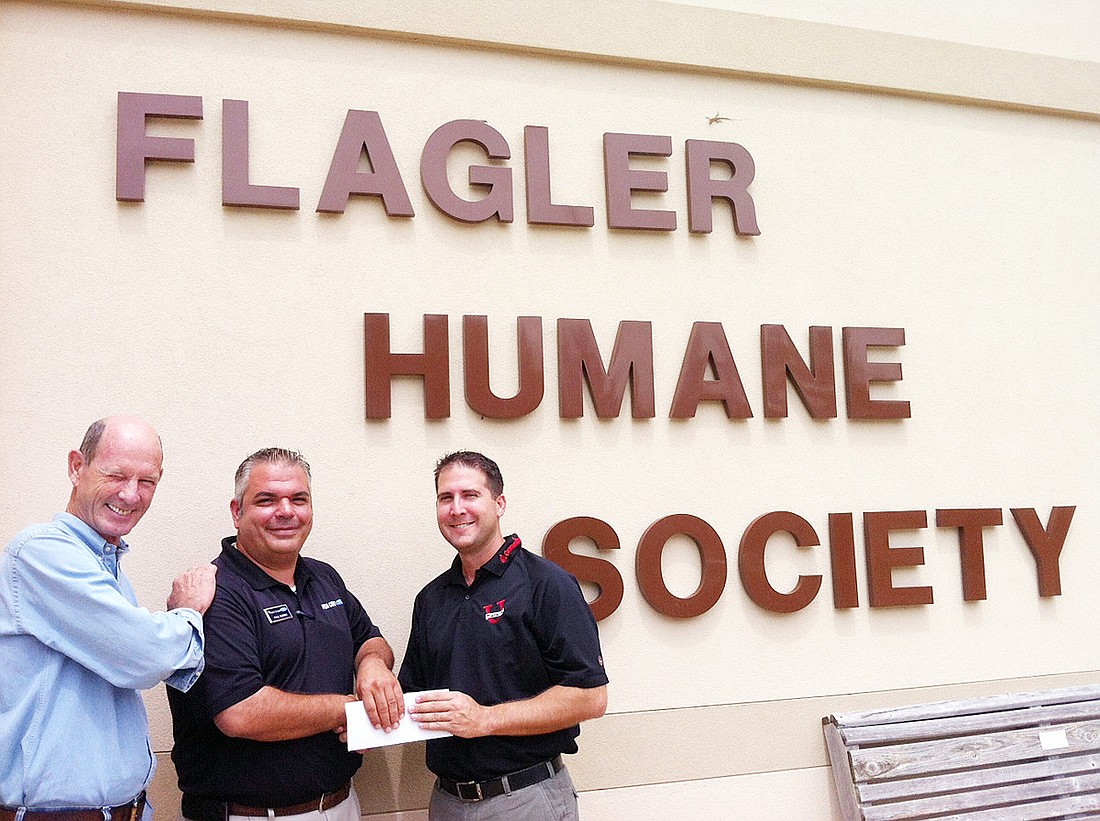 Humane Society board member Sam Cline, of Cline Construction; Paul Suma, of Palm Coast Ford; and board member Joe Rossheim, of U Name It Apparel & Graphics. COURTESY PHOTO