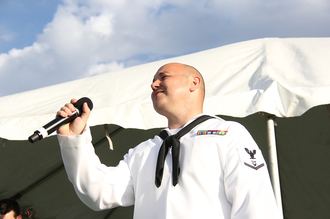Musician third class Sean Mayer, of Palm Coast, sings with the U.S. Navy Band Pride, at the May 2012 First Friday in Flagler Beach.