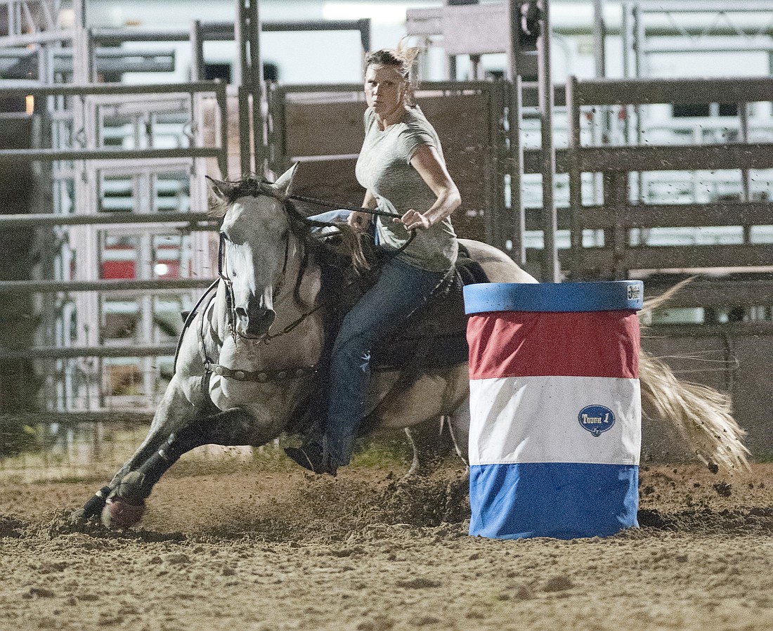 Sara Lee rides during the Jackpot Rodeo Friday, July 21, at the Flagler County Fairgrounds. PHOTOS BY BOB ROLLINS