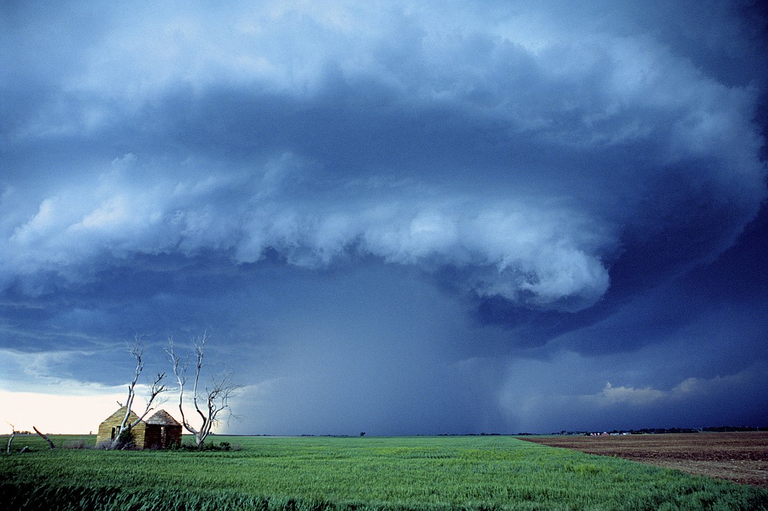 Chris Kridler captured this storm May , 2001, in Kansas. The storm formed a "mothership" appearance, indicative of rotation.