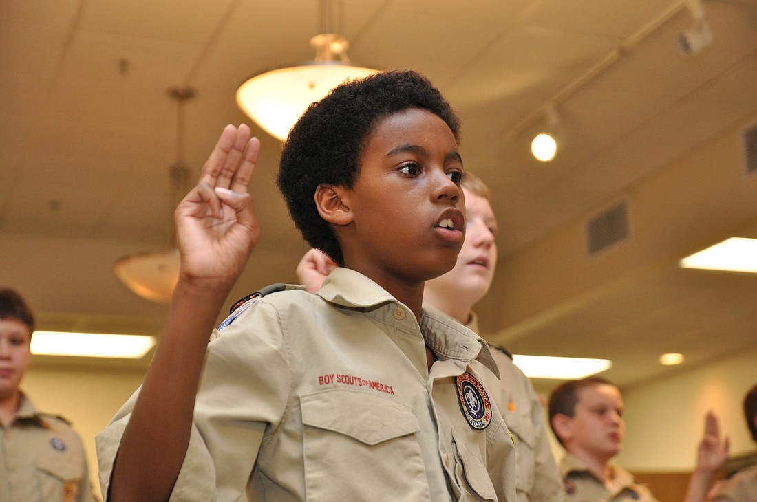 Eric Dangerfield recites the Boy Scout oath.