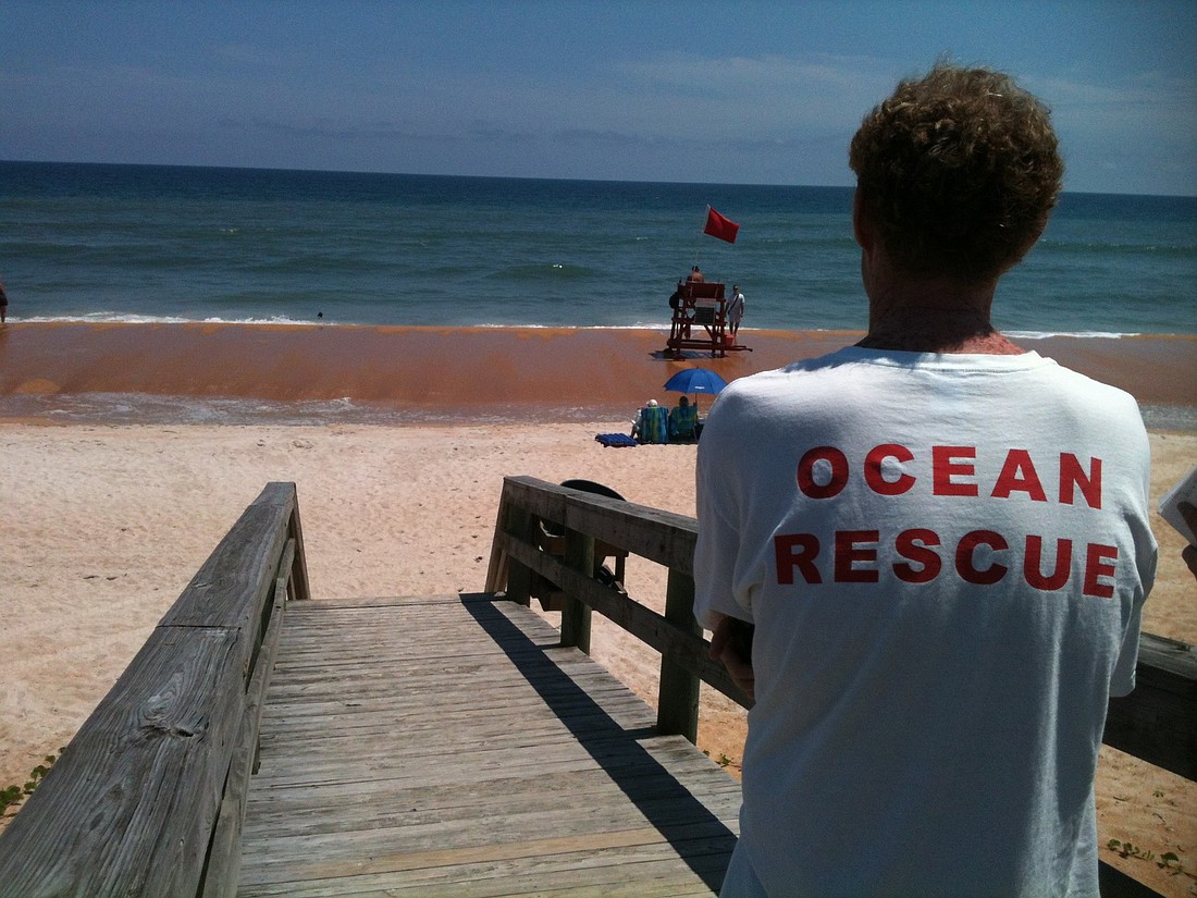 The scene at 1 p.m., as the rescue effort was under way, on Flagler beach.