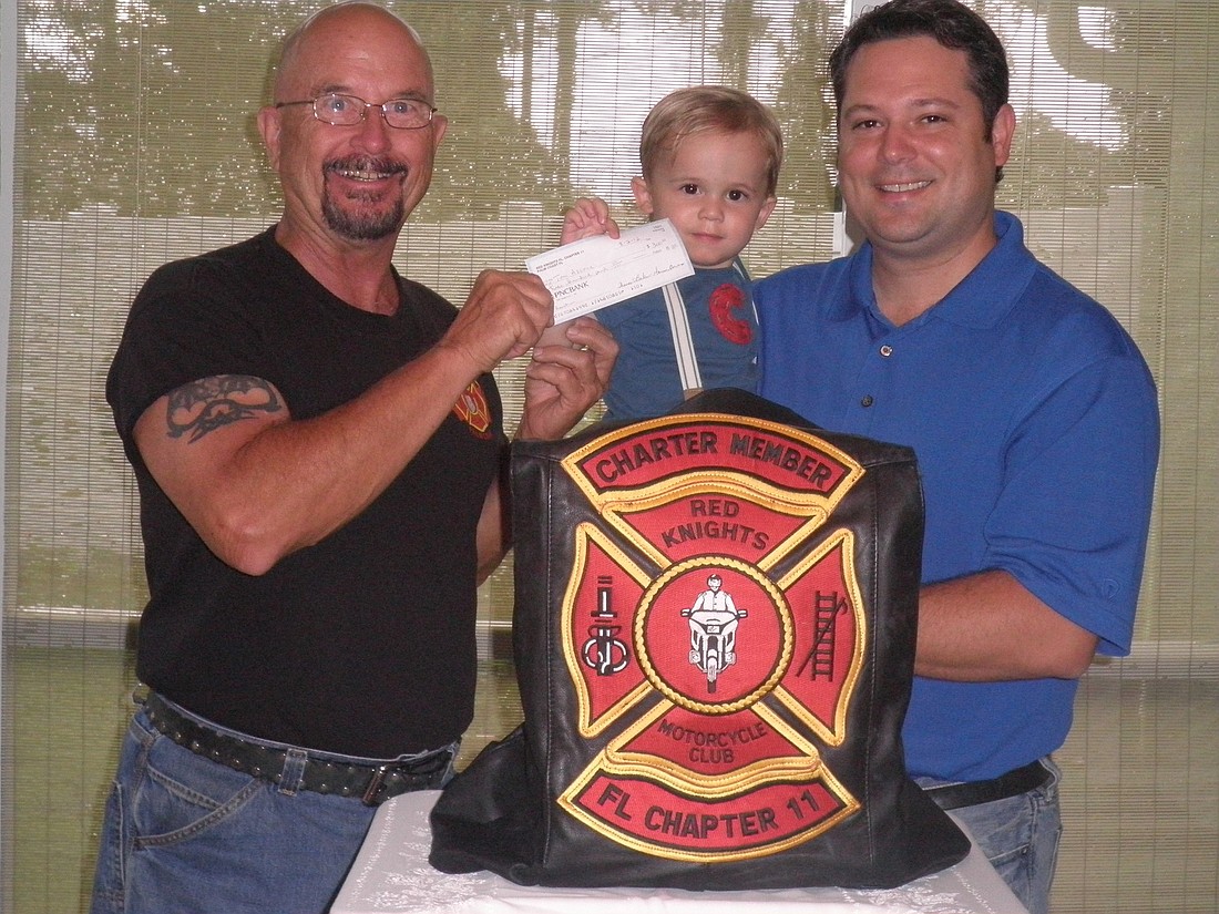 Thomas Baker, Red Knights president; Cooper Ascone; and his father, Thomas Ascone