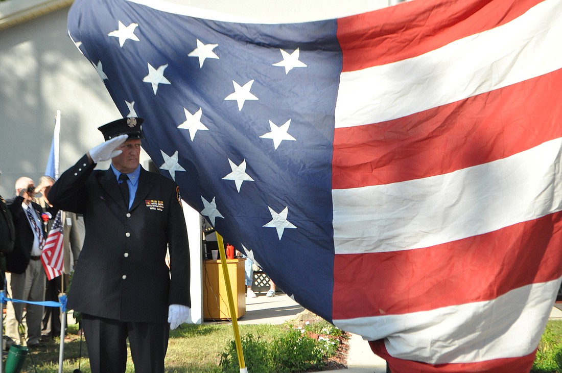 Fred Gleissner salutes at the 2011 Sept. 11 remembrance at the Palm Coast Elks. FILE PHOTO BY SHANNA FORTIER