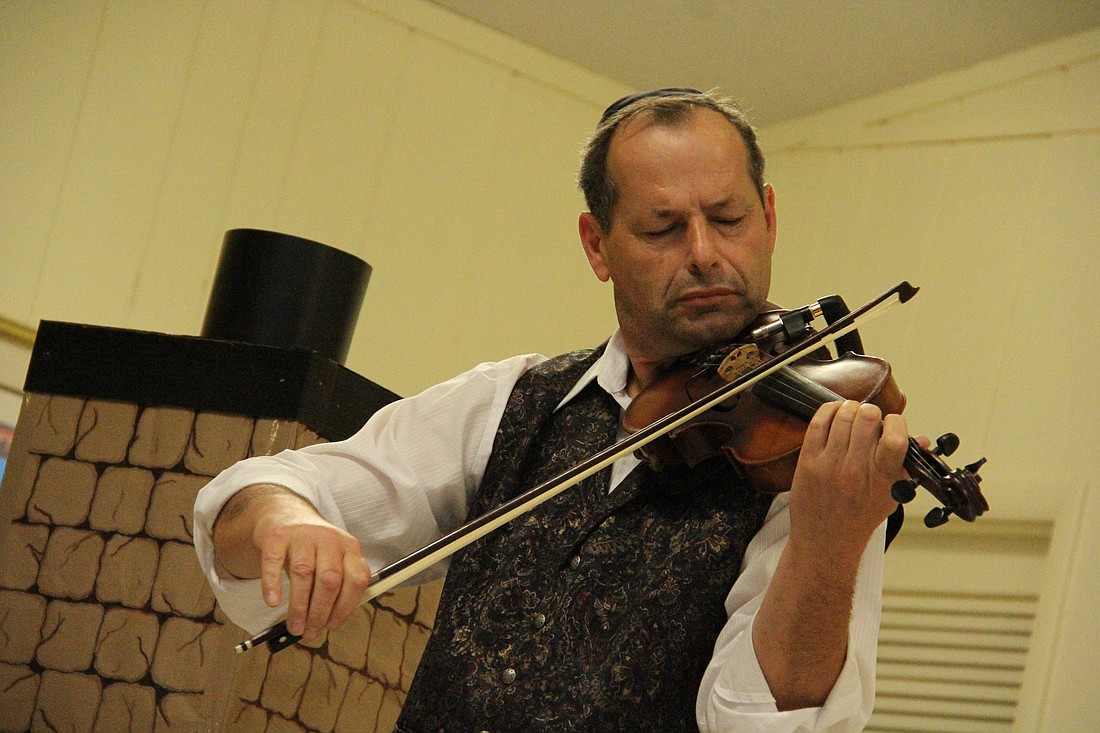 Zoriy Zinger acted as a guest violinist Sunday, Sept. 9, during Henry OrlowskiÃ¢â‚¬â„¢s rendition of two scenes from Ã¢â‚¬Å“Fiddler on the Roof.Ã¢â‚¬Â