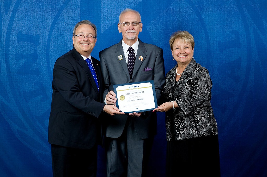 Allen Whetsell, center, receives his official certification from International Kiwanis President Tom DeJulio and his First Lady Ro.