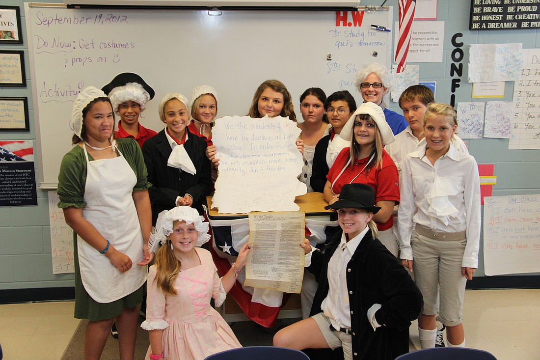 Students in Cami BrocksmithÃ¢â‚¬â„¢s seventh grade classes at Imagine School at Town Center wrote and signed their own class constitution Thursday, Sept. 20, in honor of constitution week.