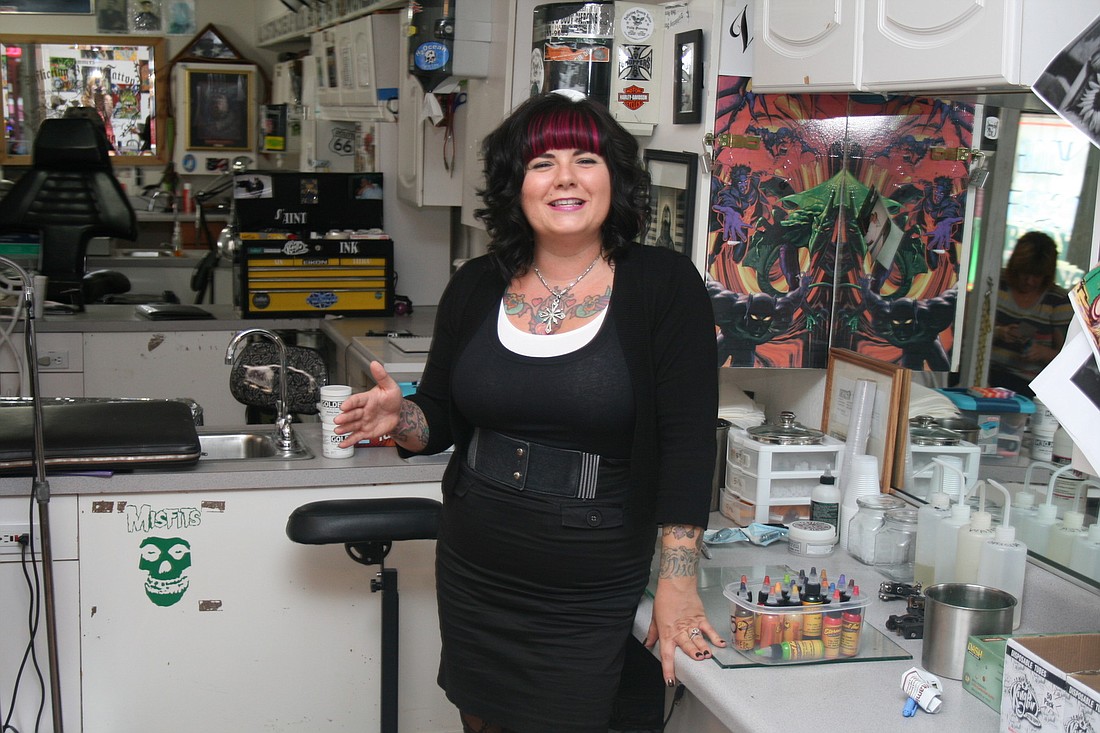 Tara Gower works at Inflicting Beauty with a staff that's like family to her. "This is not your average tattoo shop," she said.