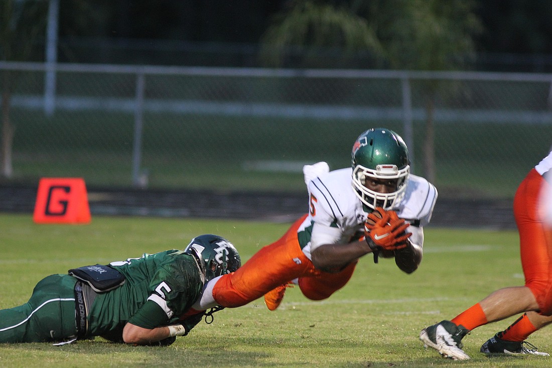 Kyle Oliver (left) had seven tackles Friday night.