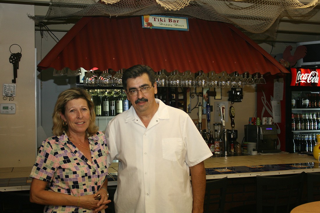 Maria Reigota-Pessoa and Joe Pessoa stand in their new restaurant.