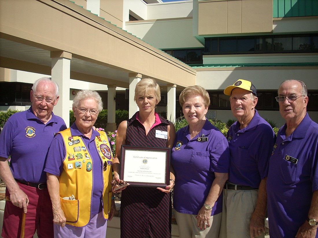 Palm Coast Lions Chuck Earnshaw, Janet Earnshaw, award recipient Mary Engle, Gwen Dean, Harry Dean and Gerry Laird