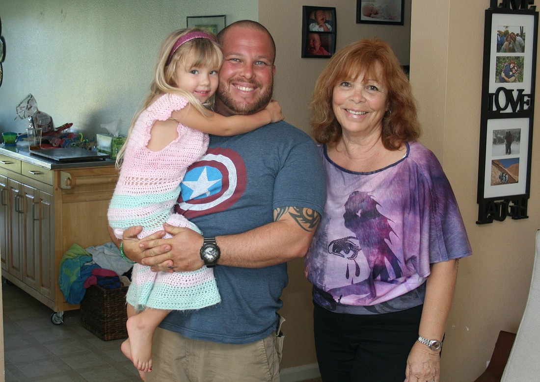 Josh Toro, his daughter Hadassah, and Elizabeth Rhoades plan for the opening of Celebrate Recovery next month.