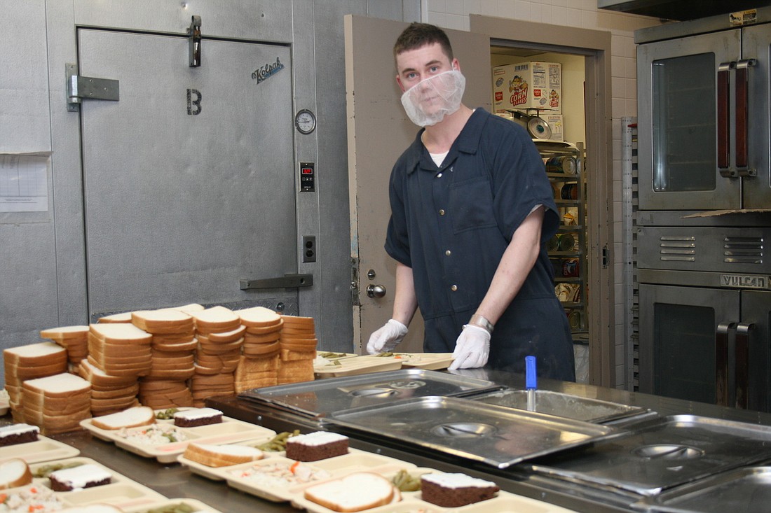 Oleh Dubrovskyy serves breakfast and lunch to inmates at the Flagler County Inmate Facility every day.