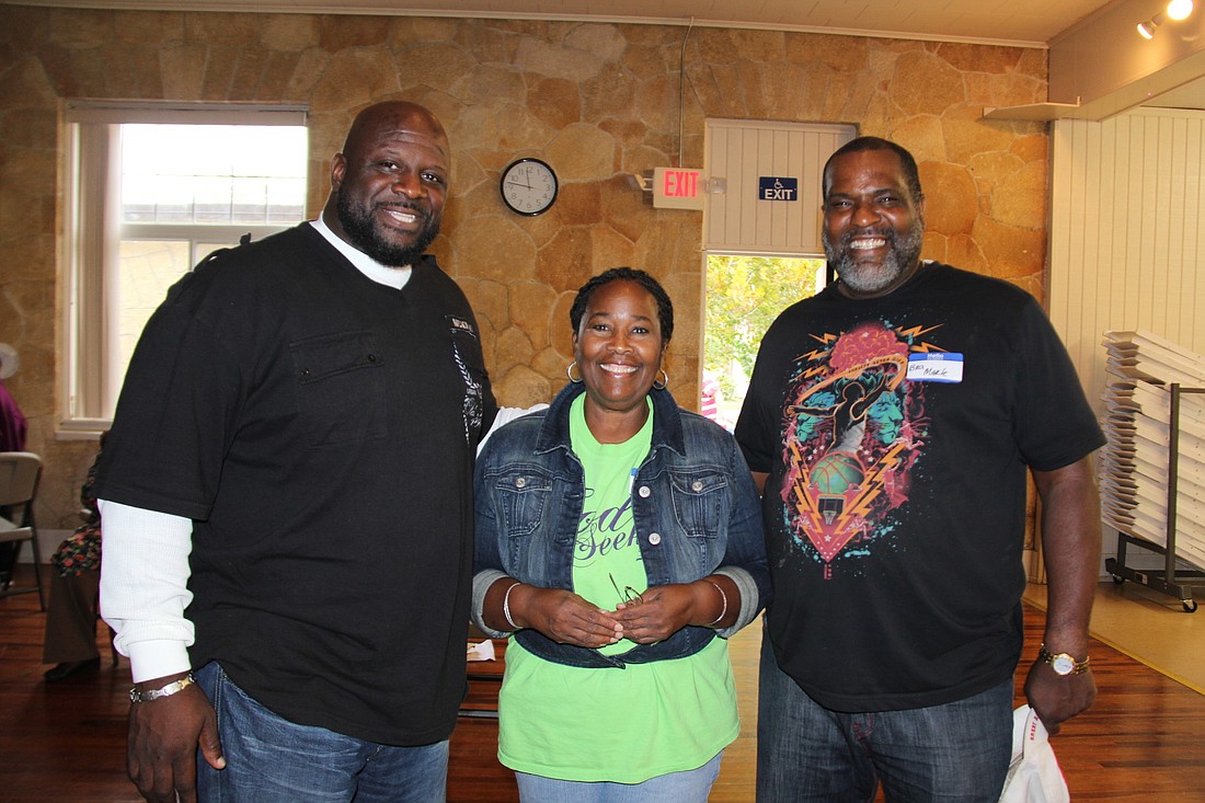 The Rev. Phillip King, of New Found Favor Ministries, Faye Dadzie, event organizer, and Mark C. Green, of St. Paul