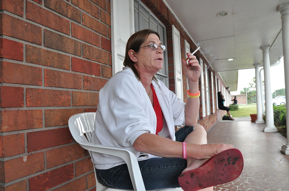 Doreen Goldstein, of Bunnell, smokes a cigarette while