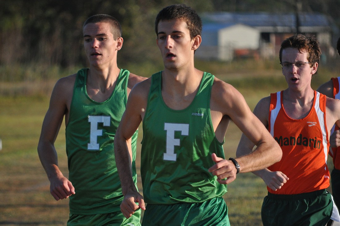 Flagler Palm Coast's Thomas Carroll (left) and Brad Walbert finished second and fifth, respectively, in the boys district championships. Carroll finished in 16:01, Walbert in 16:09.