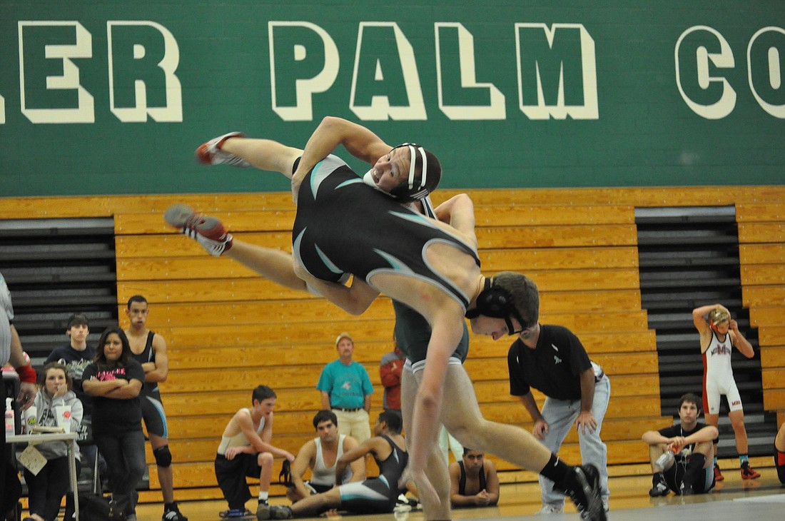Kory Bryl takes down his opponent Saturday morning in a preseason wrestling tournament at Flagler Palm Coast High School. PHOTOS BY ANDREW O'BRIEN