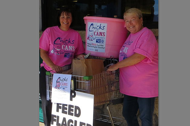 Linda Mahran and Karen Doney collect nonperishable food items for Chicks with Cans, as part of the Feed Flagler initiative. COURTESY PHOTO