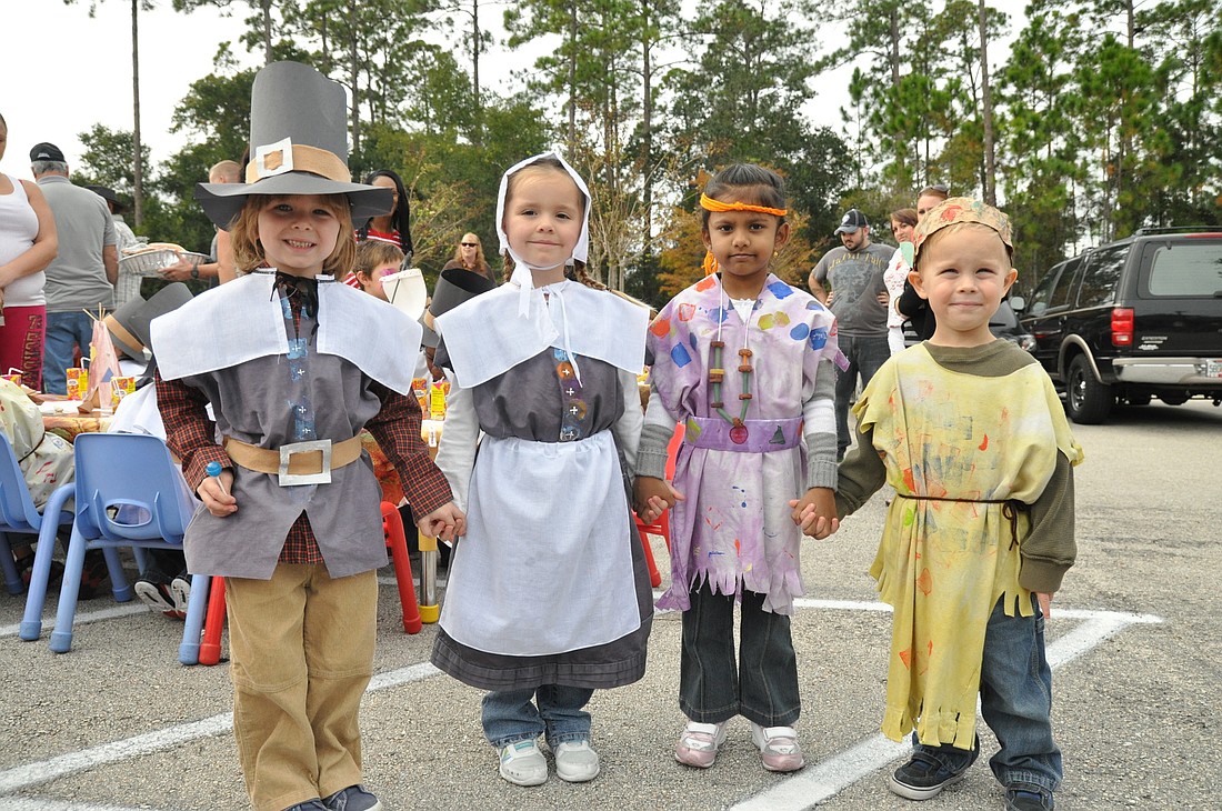 Caden Fingerhut, Leah Rudell, Janita Chandrat and Charles Oatley dressed up at Pilgrims and Indians for their Thanksgiving feast.