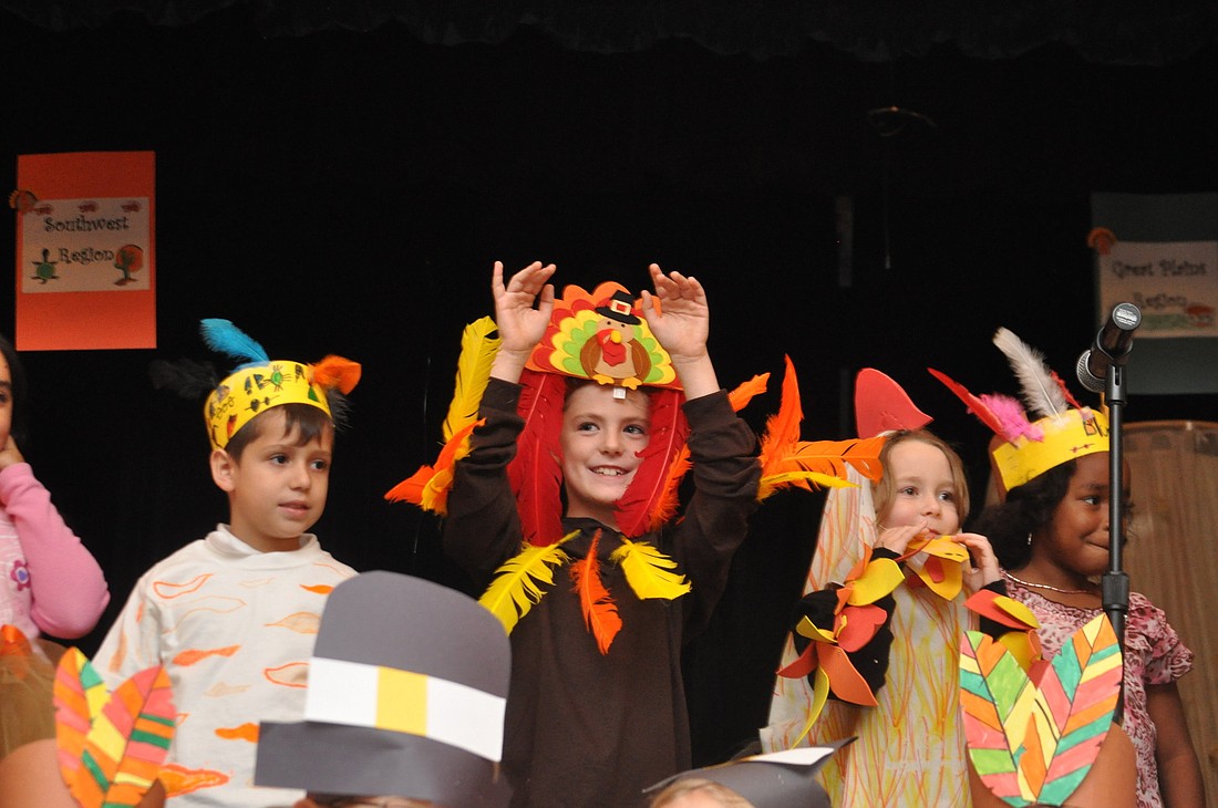 Nathan Quartier Jr. celebrates the spirit of Thanksgiving during the opening song of the play.