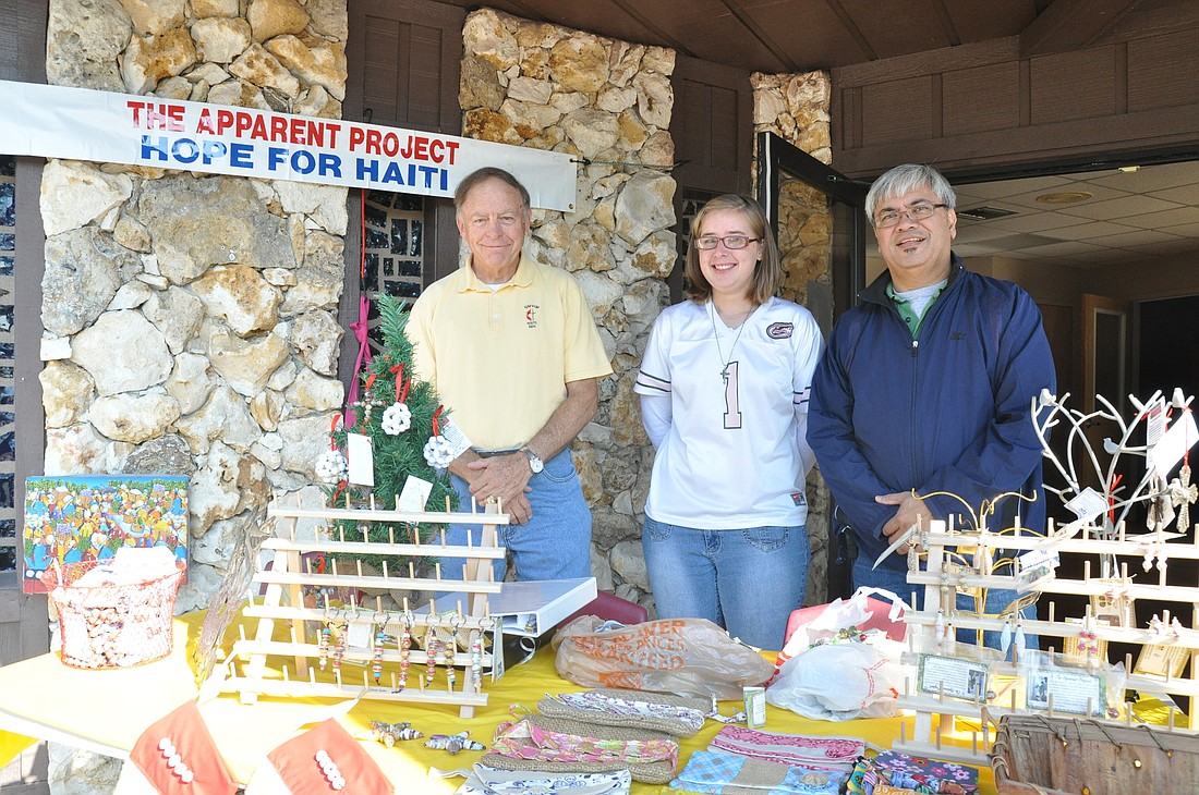 Gary Dukes, Brittany Maddux and Mike Legaspi sold items at Palm Coast United Methodist Church Nov. 24.