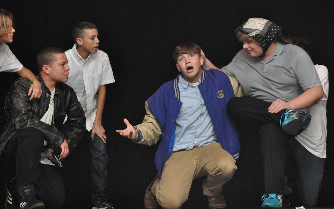 Kyle Ryan, Kyle Jestes, Carson Moree and Paul Milonas perform a scene from Ã¢â‚¬Å“West Side StoryÃ¢â‚¬Â Wednesday night at the Buddy Taylor Middle School informal drama showcase.