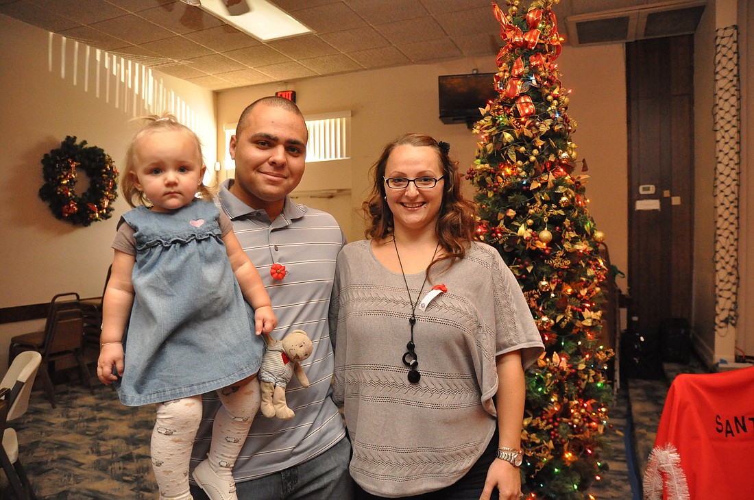 Sgt. James Wilson and his wife, Sabrina, and daughter, Jordyn