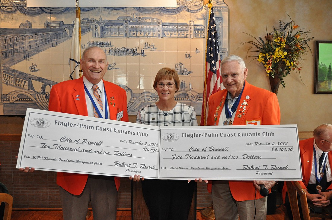 Frank Consentino, Bunnell Mayor Catherine Robinson and Bill Klinkenberg